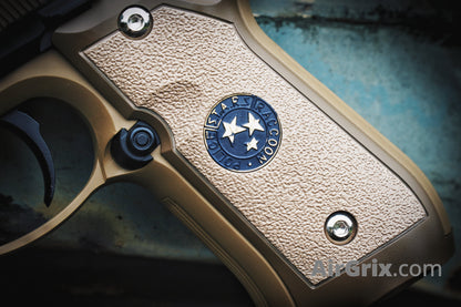 WE M9 Biohazard 20th Anniversary Tan GBB Pistol, blue S.T.A.R.S. Raccoon Police grip medallion macro detail
