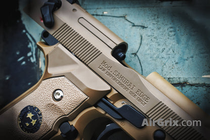 WE M9 Biohazard 20th Anniversary Tan GBB Pistol, right slide close-up with Samurai Edge engraving and rear serrations